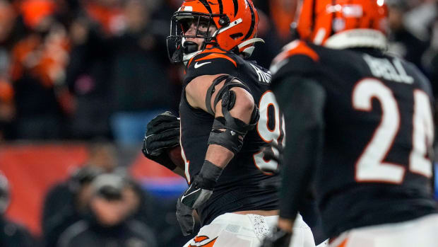 Cincinnati Bengals defensive end Sam Hubbard (94) breaks away with a stripped ball for a 98 yard go-ahead touchdown in the fourth quarter during an NFL wild-card playoff football game between the Baltimore Ravens and the Cincinnati Bengals, Sunday, Jan. 15, 2023, at Paycor Stadium in Cincinnati. The Bengals advanced to the Divisional round of the playoffs with a 24-17 win over the Ravens. Baltimore Ravens At Cincinnati Bengals Afc Wild Card Jan 15 335 Syndication The Enquirer